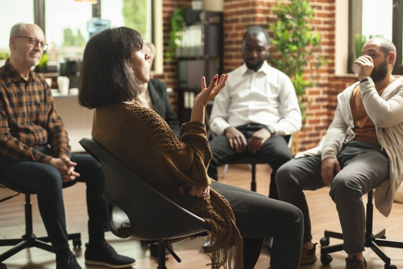Woman sharing her feelings at therapy